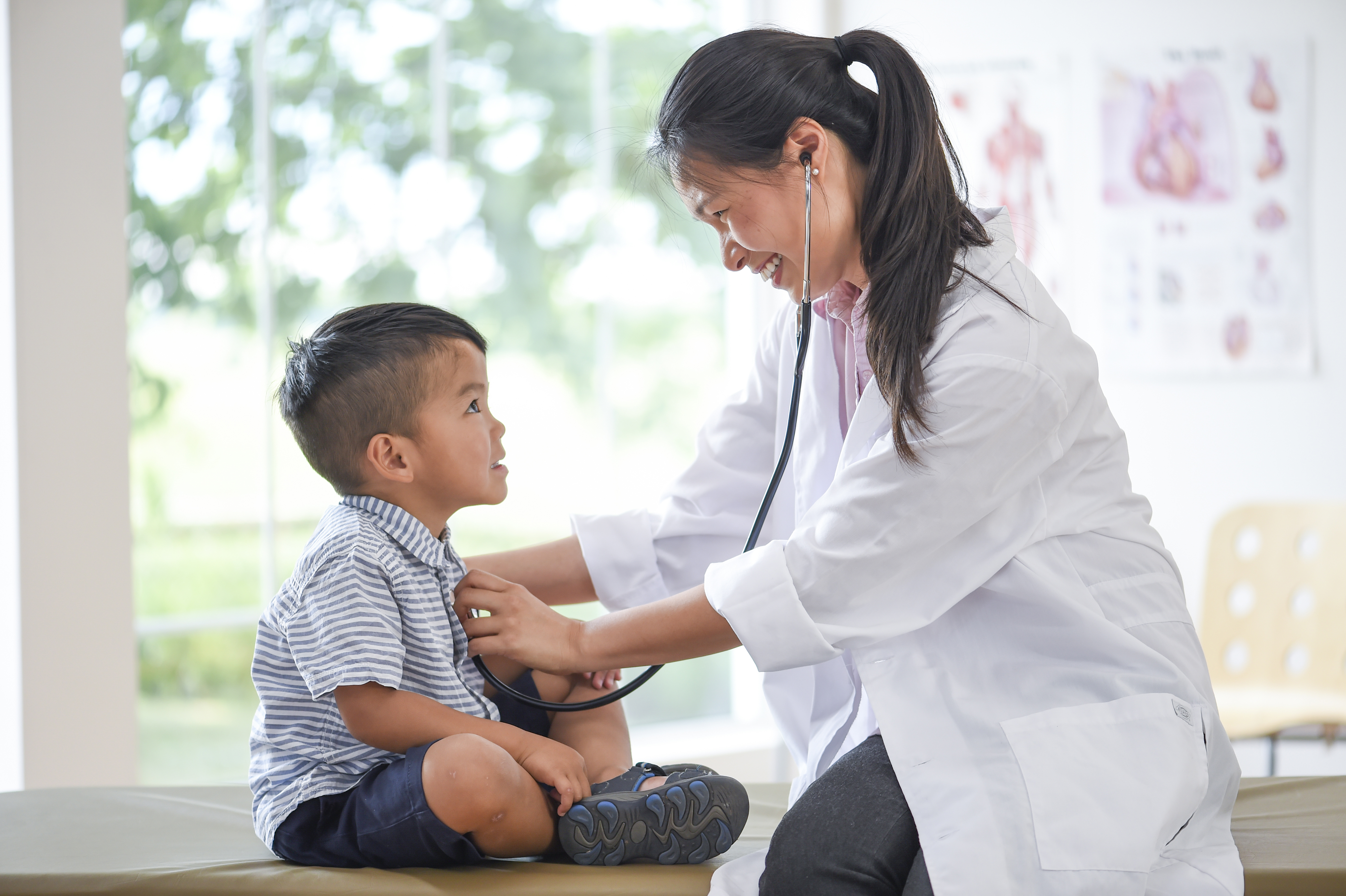 Doctor examining child