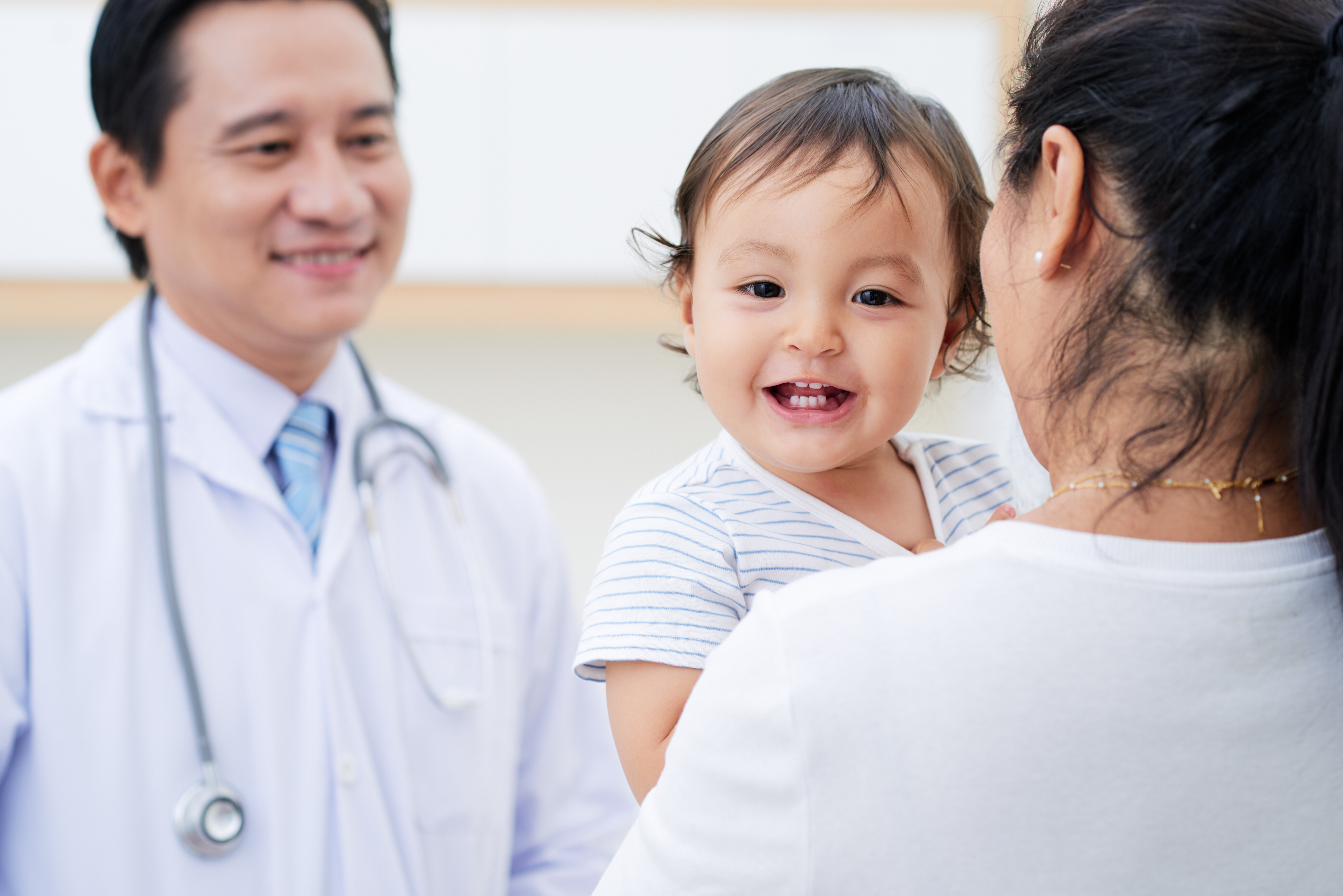 Toddler at the pediatrician with parent