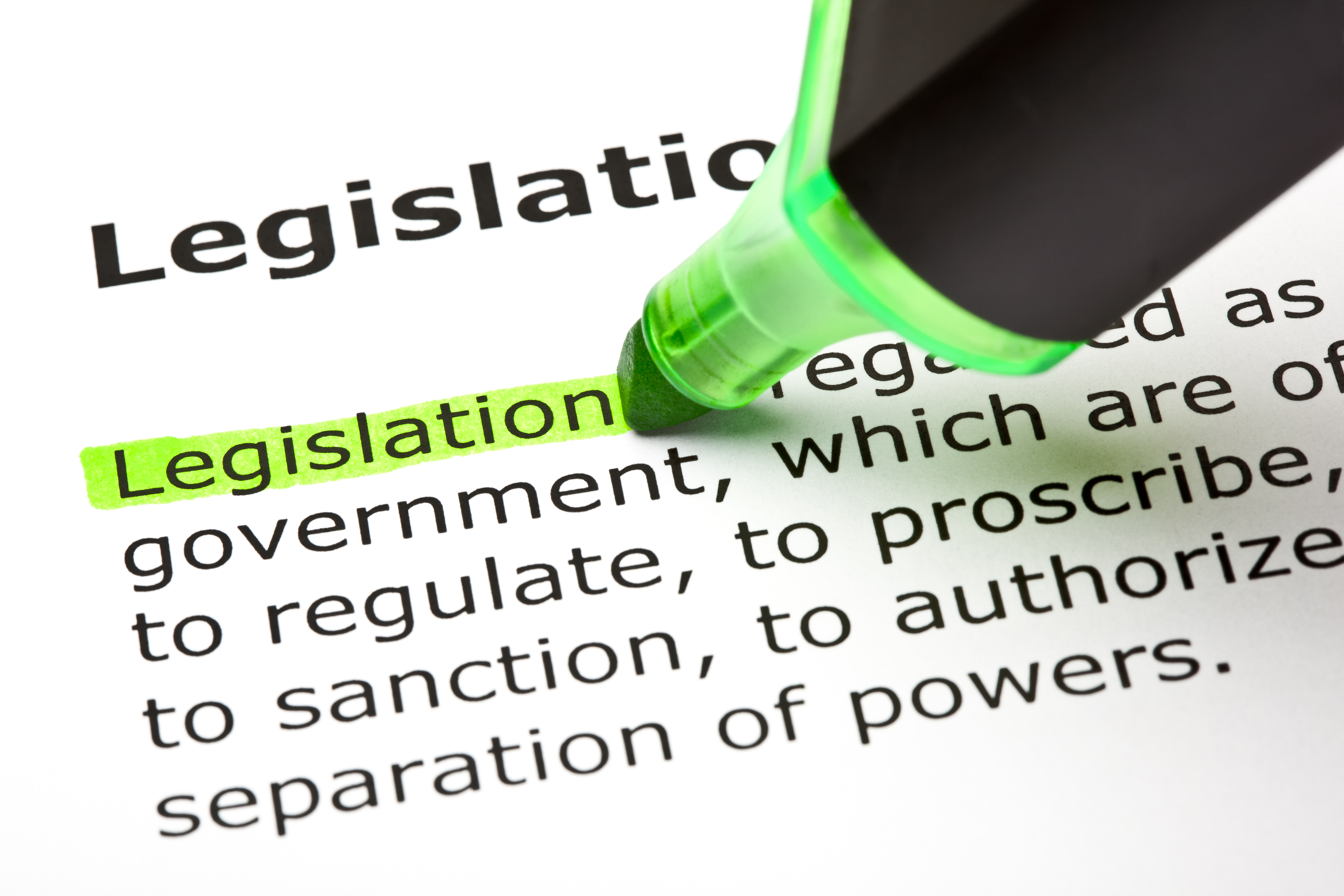 Green highlighter emphasizing the word legislation on page of text.