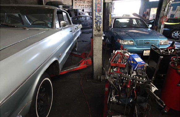The car involved in the incident is seen with the open door of the garage far in the background - with four cars parked between it and the entrance to the garage.