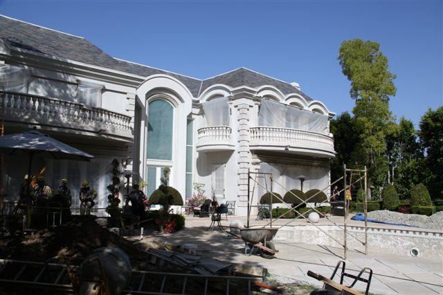 The backyard and rear of the house where the incident occured showing multiple renovation staging areas.
