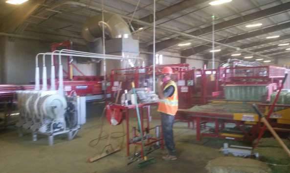 The hay baler operator's station showing the close proximity to the baling machinery.