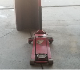 rear view of a hydraulic jack with wheels