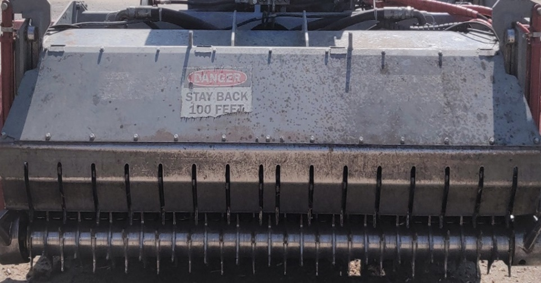 Faded warning sticker on the front of the shredder