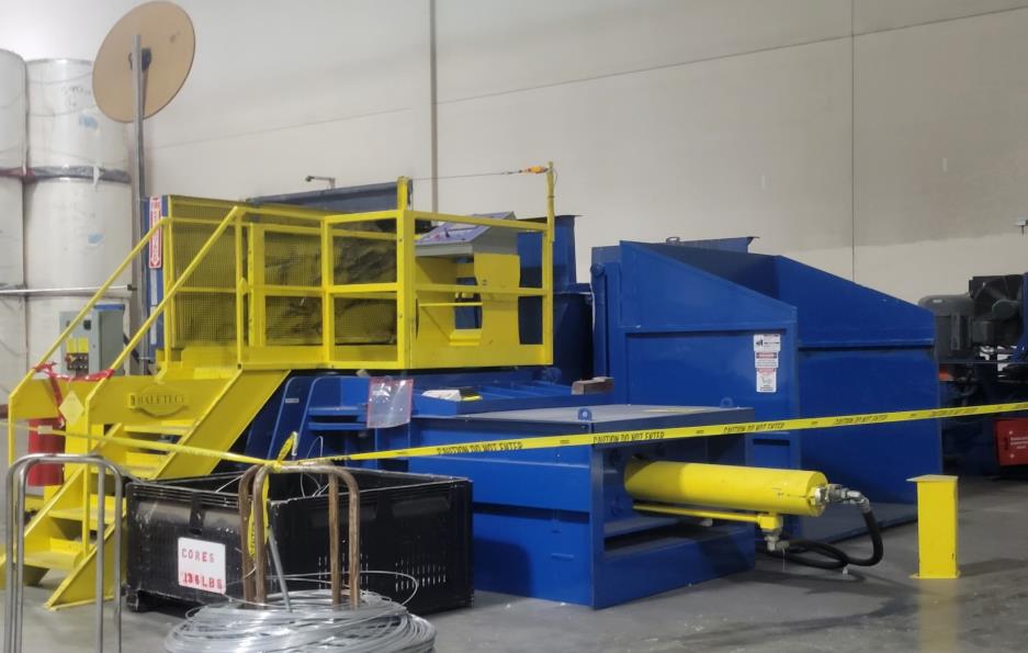 The hydraulic compression where the finished bale is pushed  out of the machine