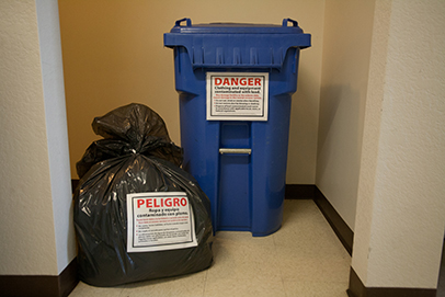 Warning signs on bins