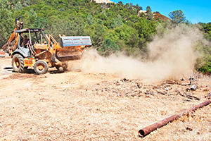 Bulldozer kicking up dust