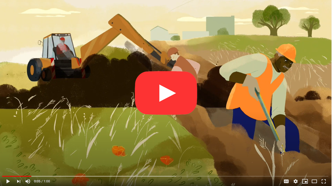 video still shot of man digging in a dusty trench