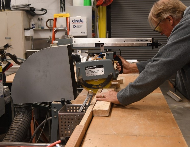 Man sawing wood