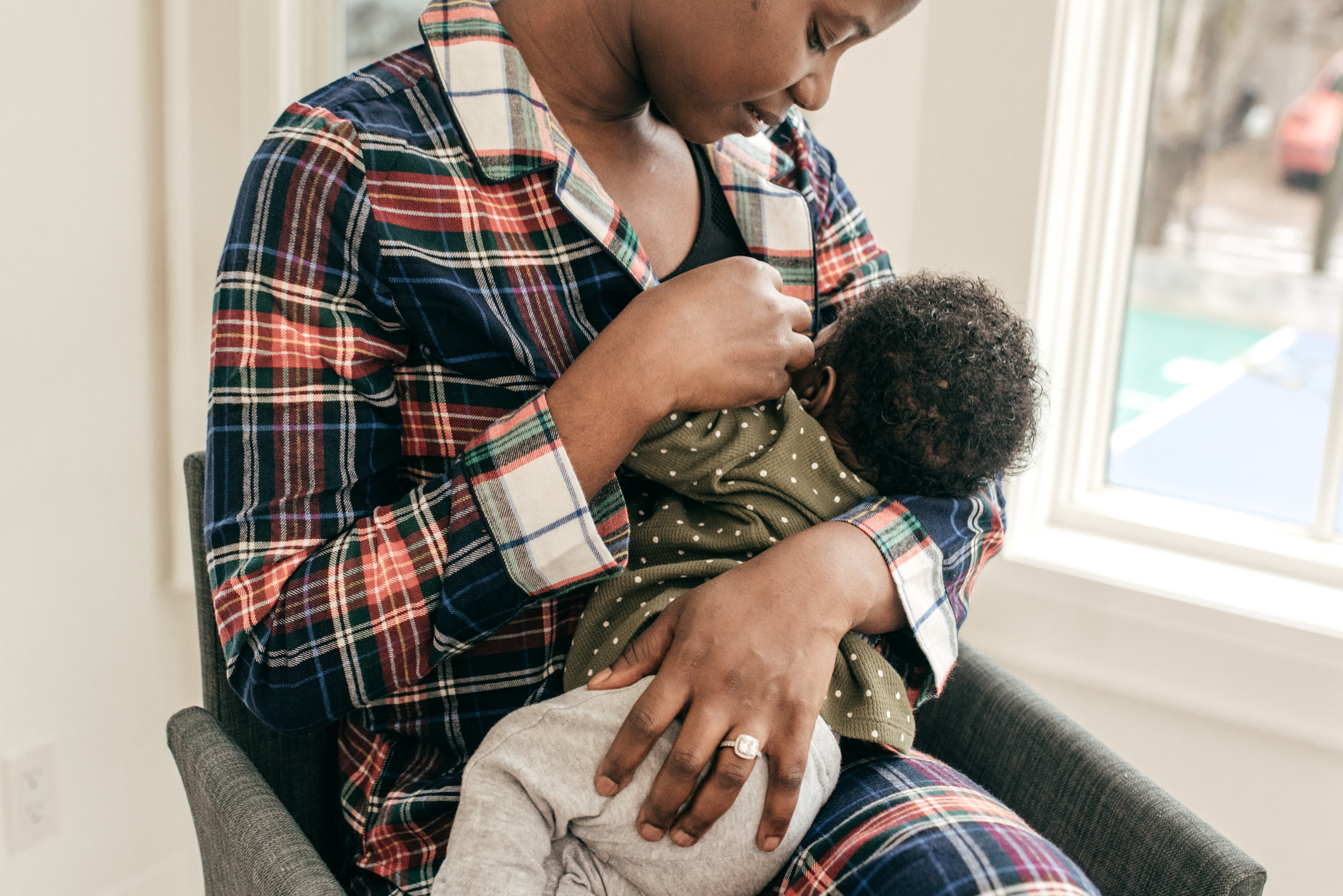 Woman nursing a baby.