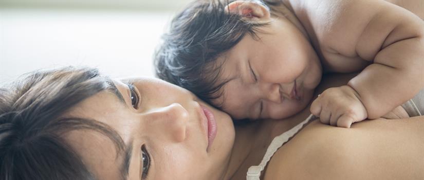 Baby sleeping on mom's chest