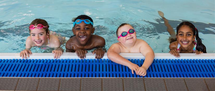 four children in a pool