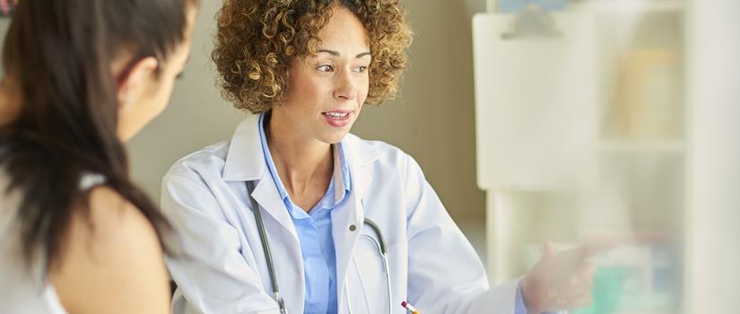Healthcare provider consulting with patient