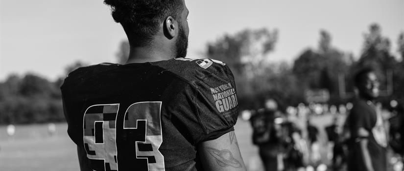 NCAA football athlete on playing field