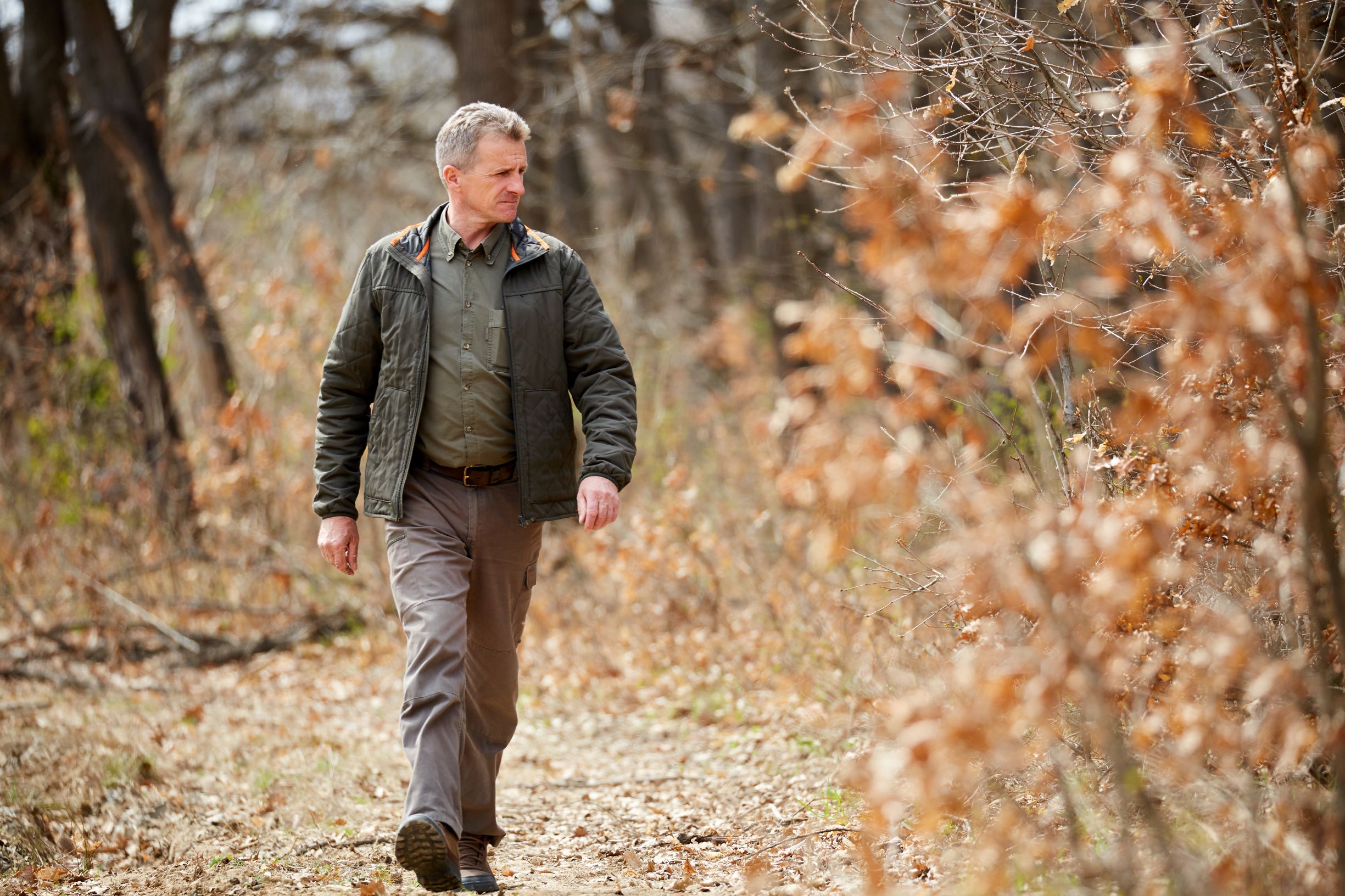 Park service staff walking outside in the fall