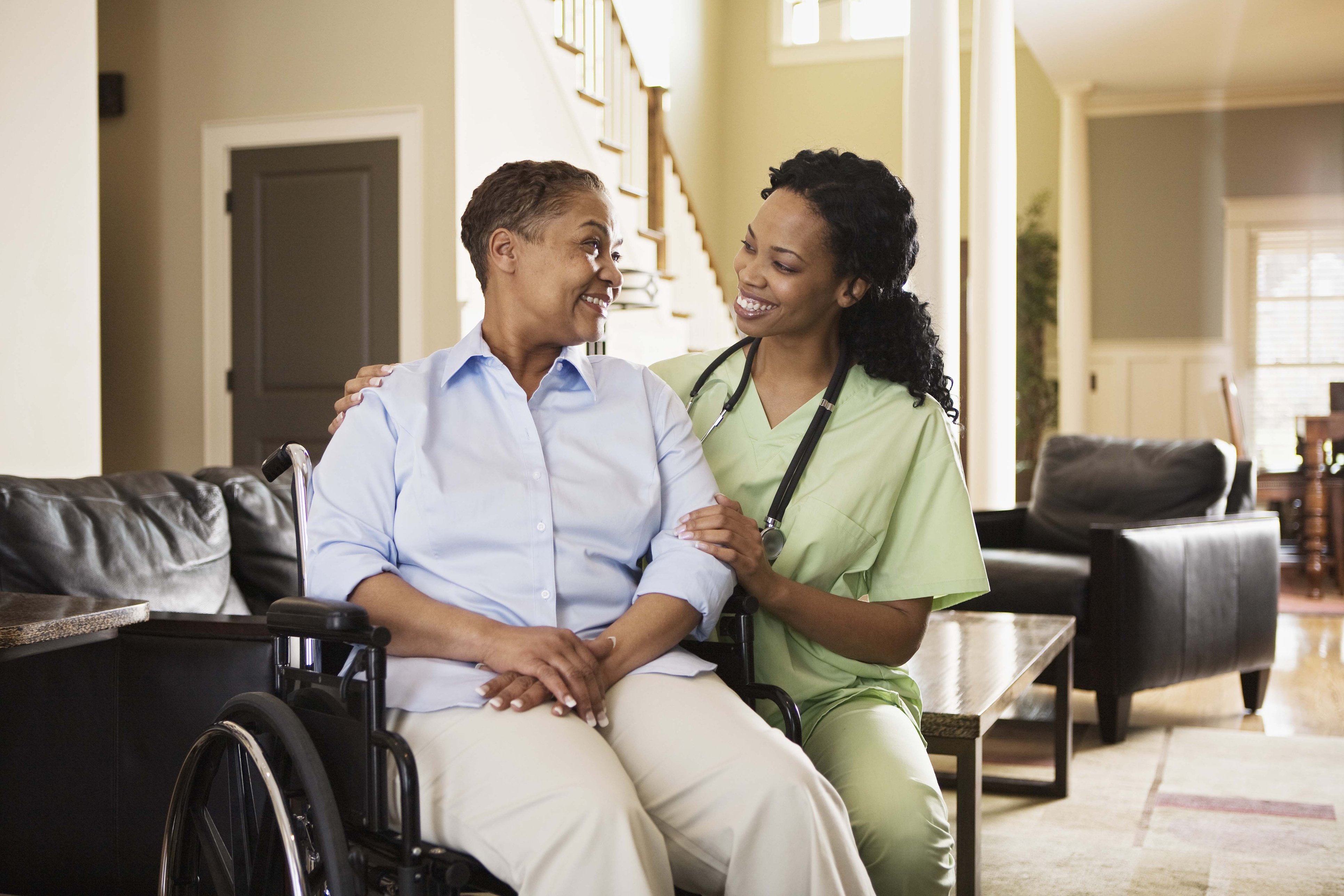 woman in wheelchair with nurse