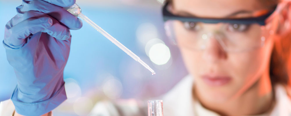 Scientist using test tube