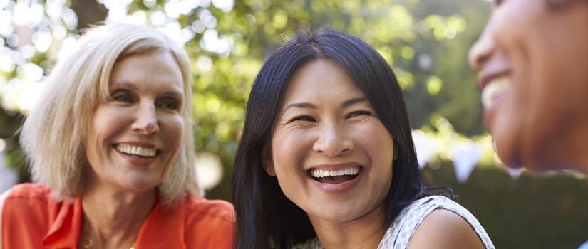 Small group of women of various ages and ethnicities enjoying a conversation
