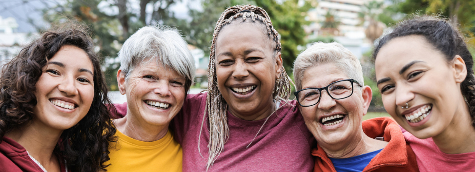 Women smiling outside.